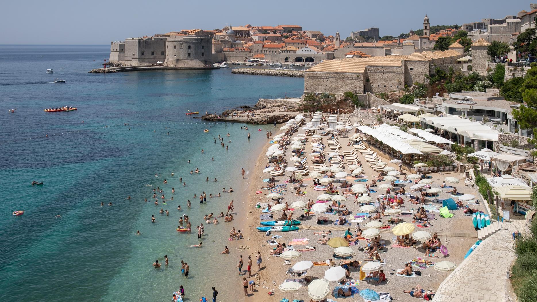An aerial view of a crowded beach during the summer in Croatia.