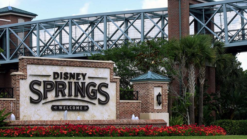 A sign at the entrance to Disney Springs at Walt Disney...