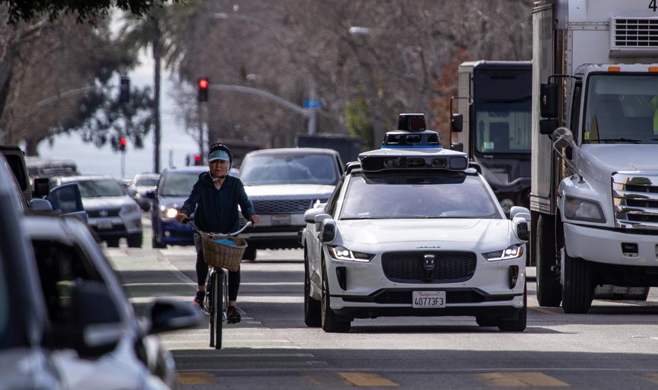 Self-driving Waymo cars on the road in Santa Monica