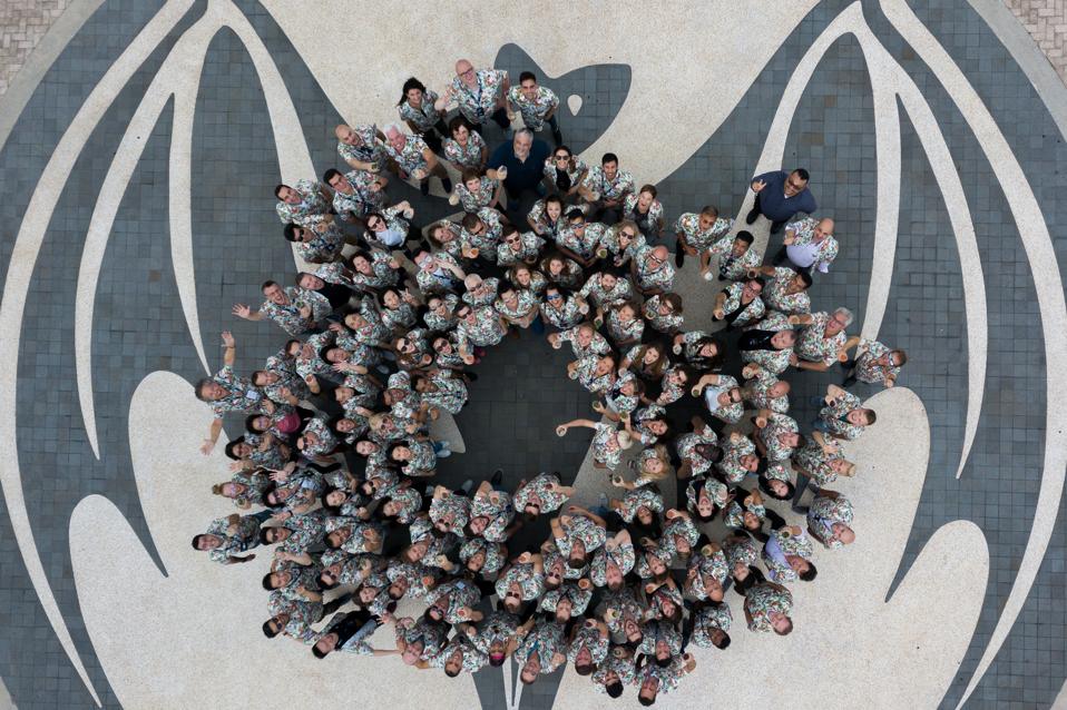 Bacardi employees on the Bacardi bat logo at Casa Bacardi distillery and visitor center, Puerto Rico.