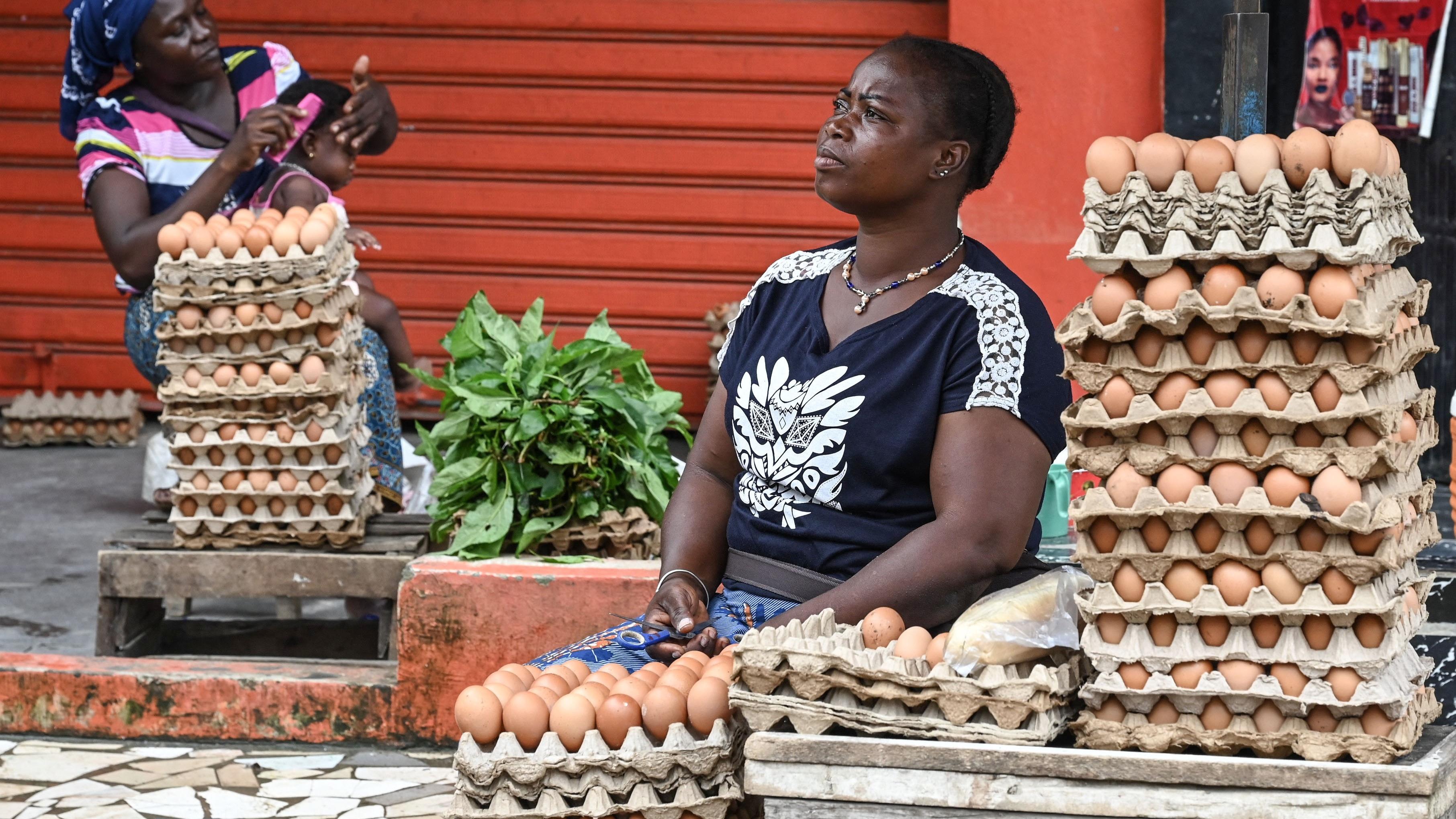 A vendor sells eggs on the street in Abidjan in West Africa.