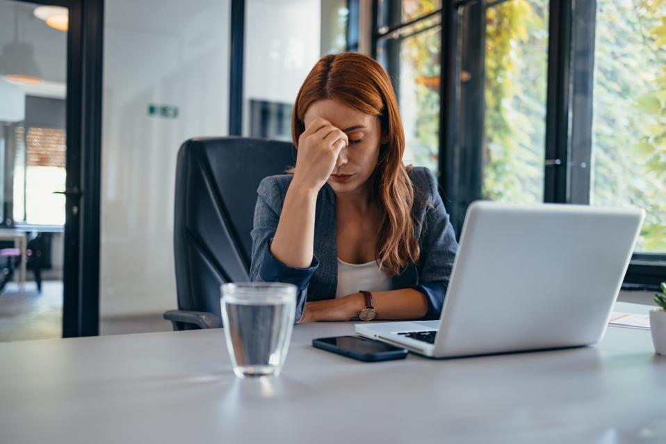 https://specials-images.forbesimg.com/imageserve/6717b5eb106db7ce03a5b0bc/Woman-in-office-with-laptop-and-water-glass--feeling-stressed-out-/960x0.jpg?fit=scale