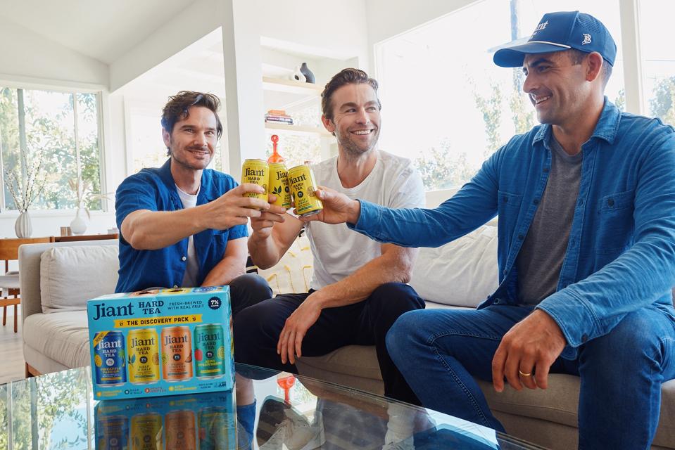 Telch, Crawford and Haertel holding Jiant hard tea