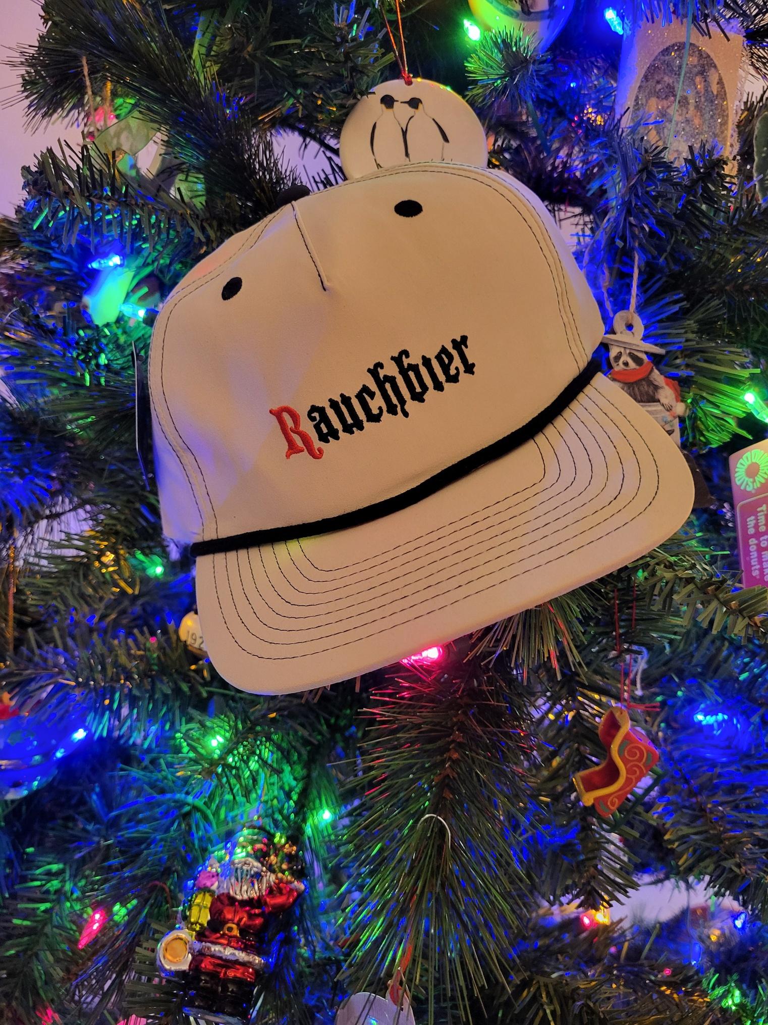 A Rauchbier baseball cap in a Christmas tree.
