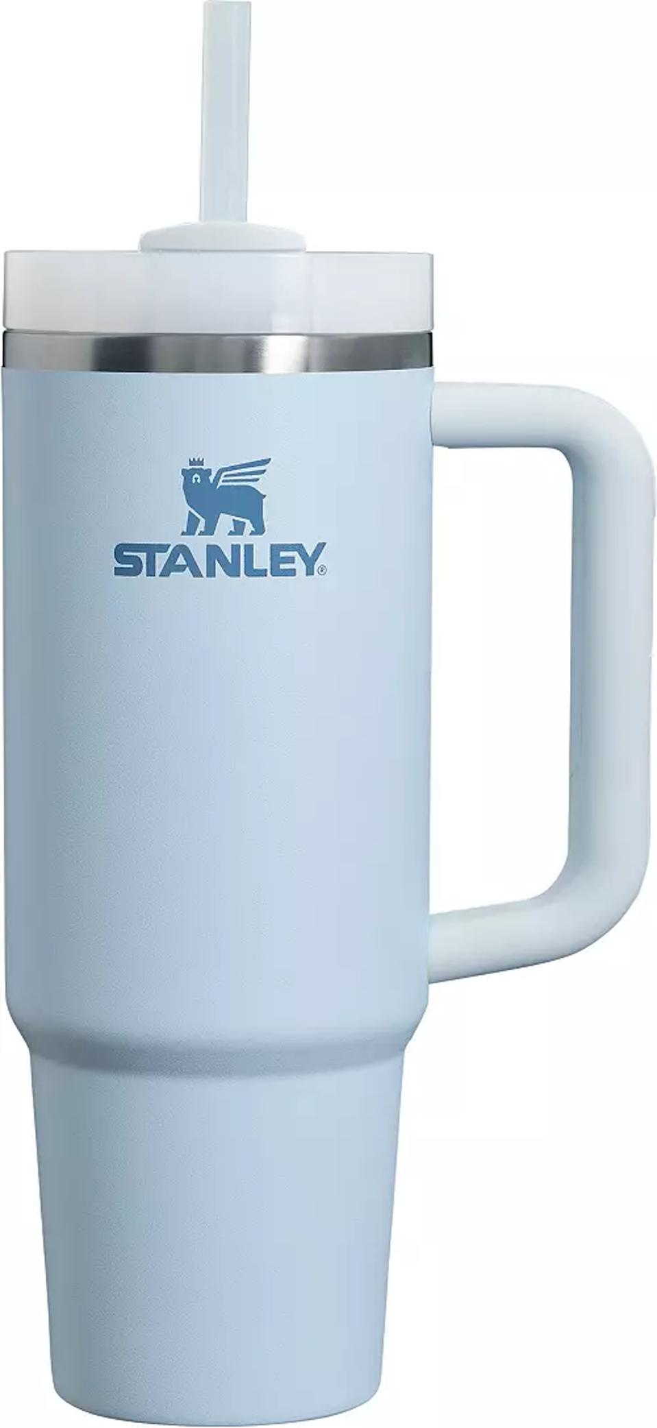 maroon Stanley Quencher H2.0 FlowState tumbler on speckled marble counter against gray bg