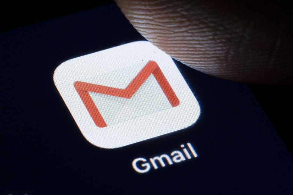 Gmail app icon with finger poised to click.