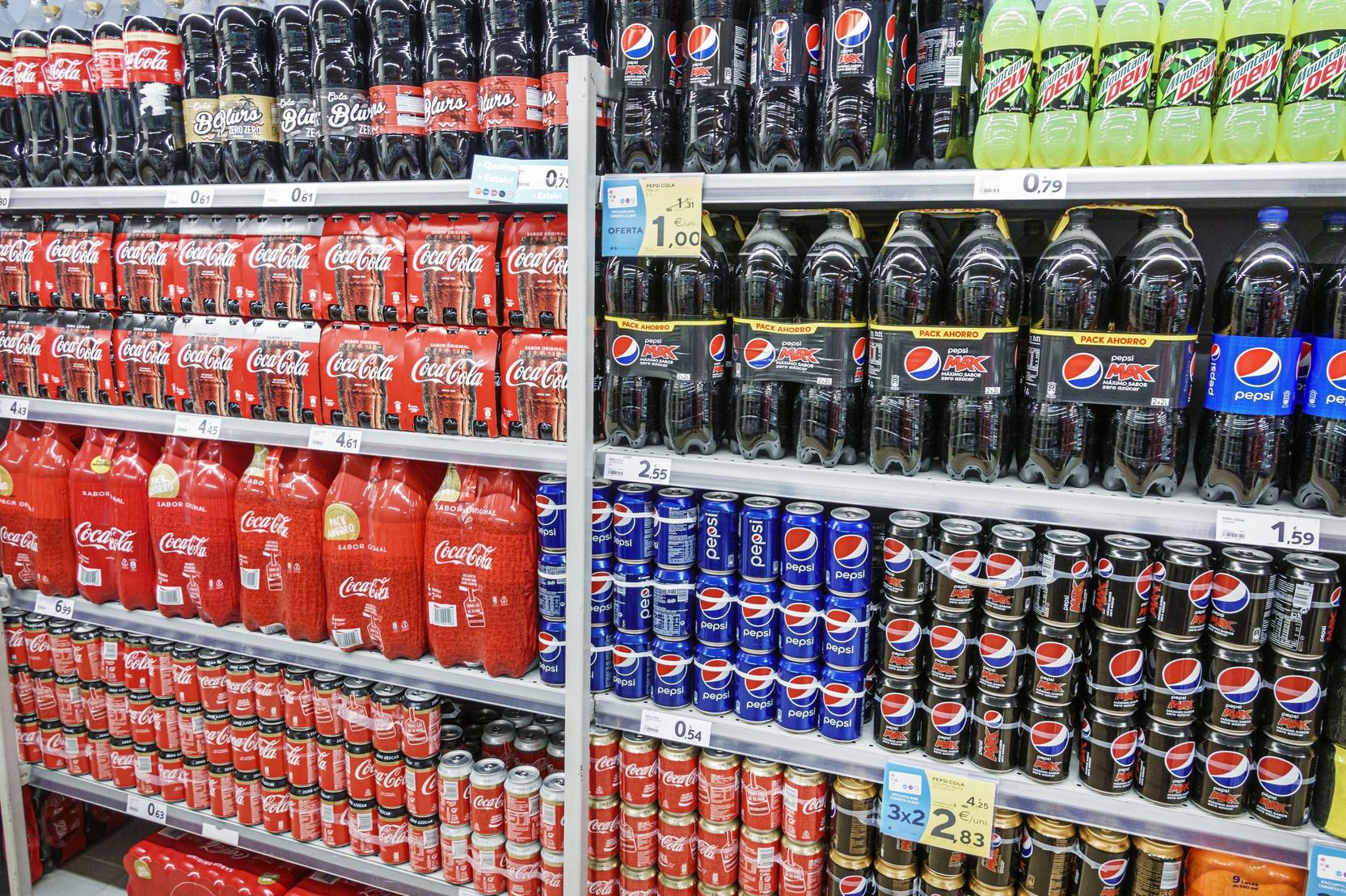 Spain, Barcelona, Caprabo, supermarket soft drinks and soda aisle, Coca cola, Pepsi