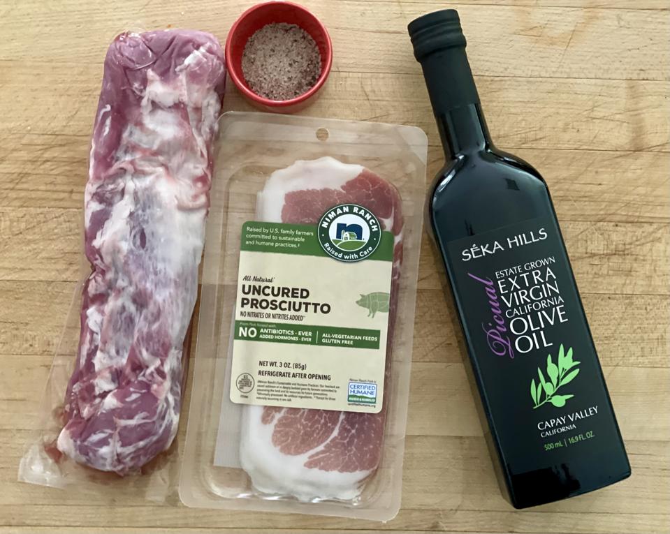 This recipe is so simple that after you make it the first time, you won't need a recipe. EVOO, salt & pepper and Prosciutto is all you need to dress up a pork tenderloin. In this photograph by Elizabeth Karmel is a 1-pound pork tenderloin, EVOO, salt & pepper and a package of Prosciutto.