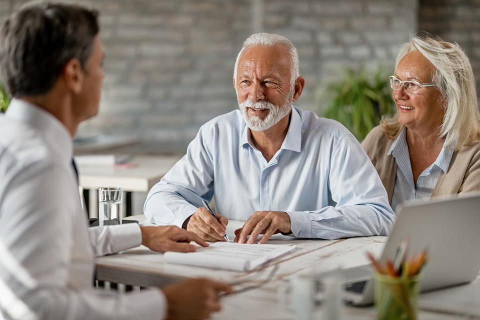 Retired couple meeting with an advisor