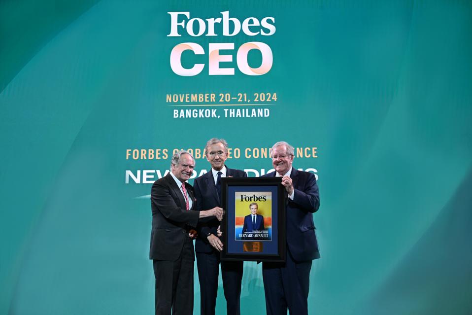 Bernard Arnault (middle) receives the Malcolm S. Forbes Lifetime Achievement Award from Christopher Forbes (left), vice-chairman of Forbes Media, and Steve Forbes (right), chairman and editor-in-chief of Forbes Media.