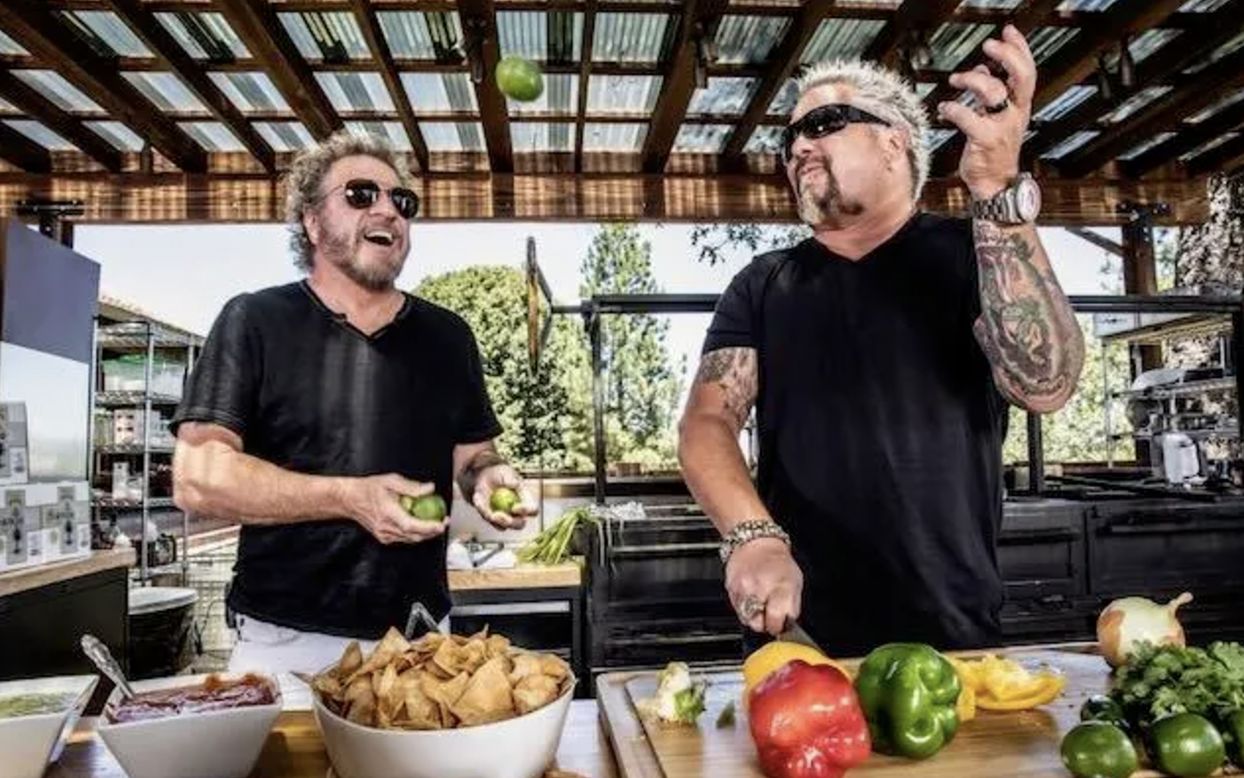 Sammy Hagar and Guy Fieri juggle limes while promoting Santo Tequila.