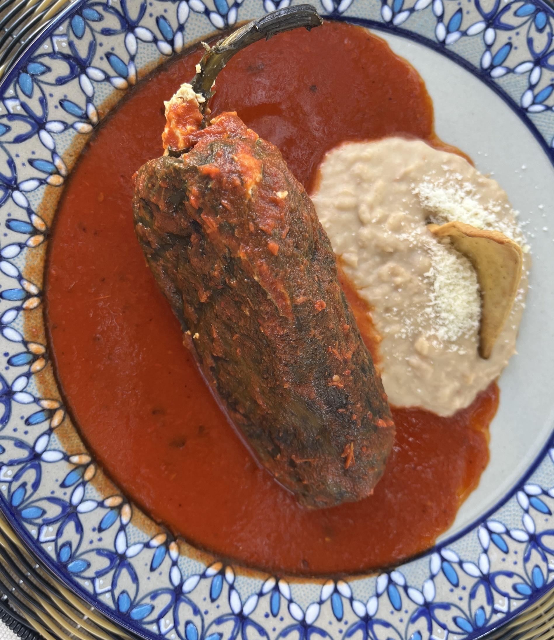 A poblano pepper stuffed with corn tamal in a wild sage sauce.