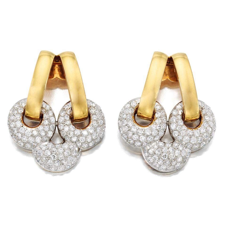 A pair of trefoil Suzanne Belperron dress clips, set with pavé diamonds, at Phillips.