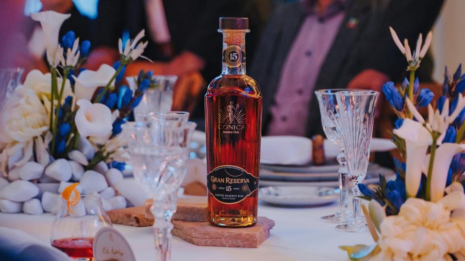 Havana Club's Icónica 15-year-old Gran Reserva Añejo 15 Años placed in a dinner table setting.