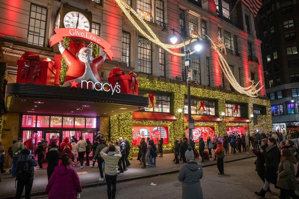 People line up outside of Macy's flagship store before opening on Black Friday, in New York City on November 29, 2024.