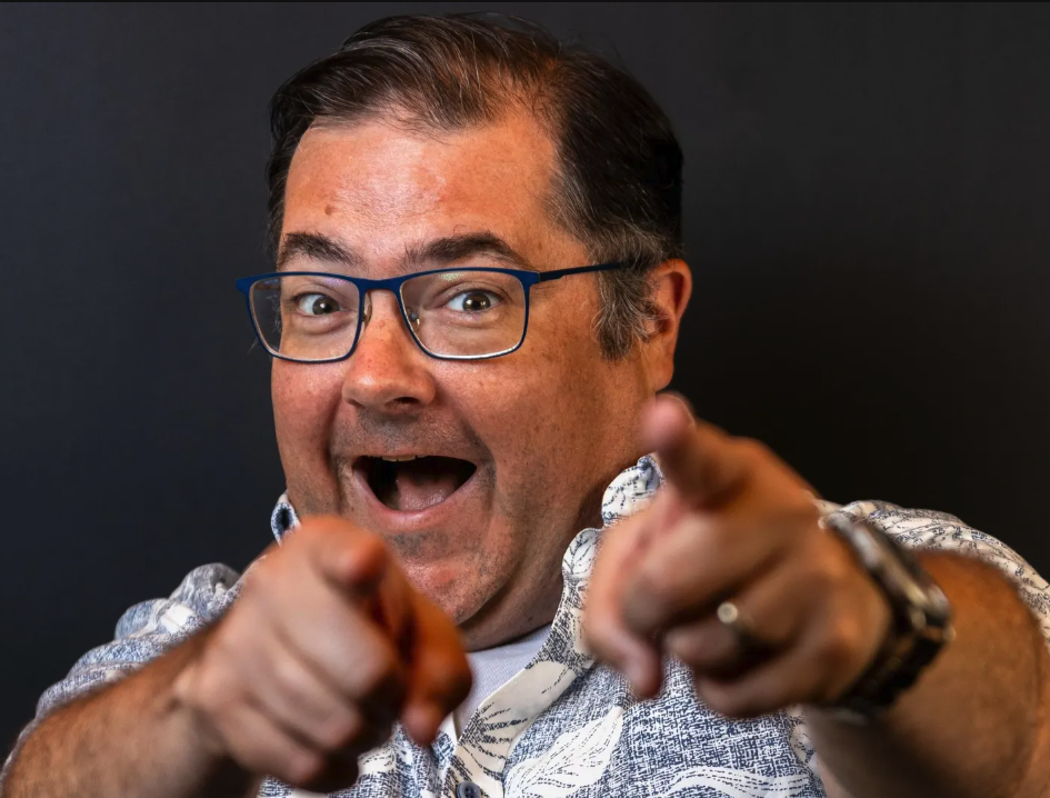John Holl seen with a happy facial expression