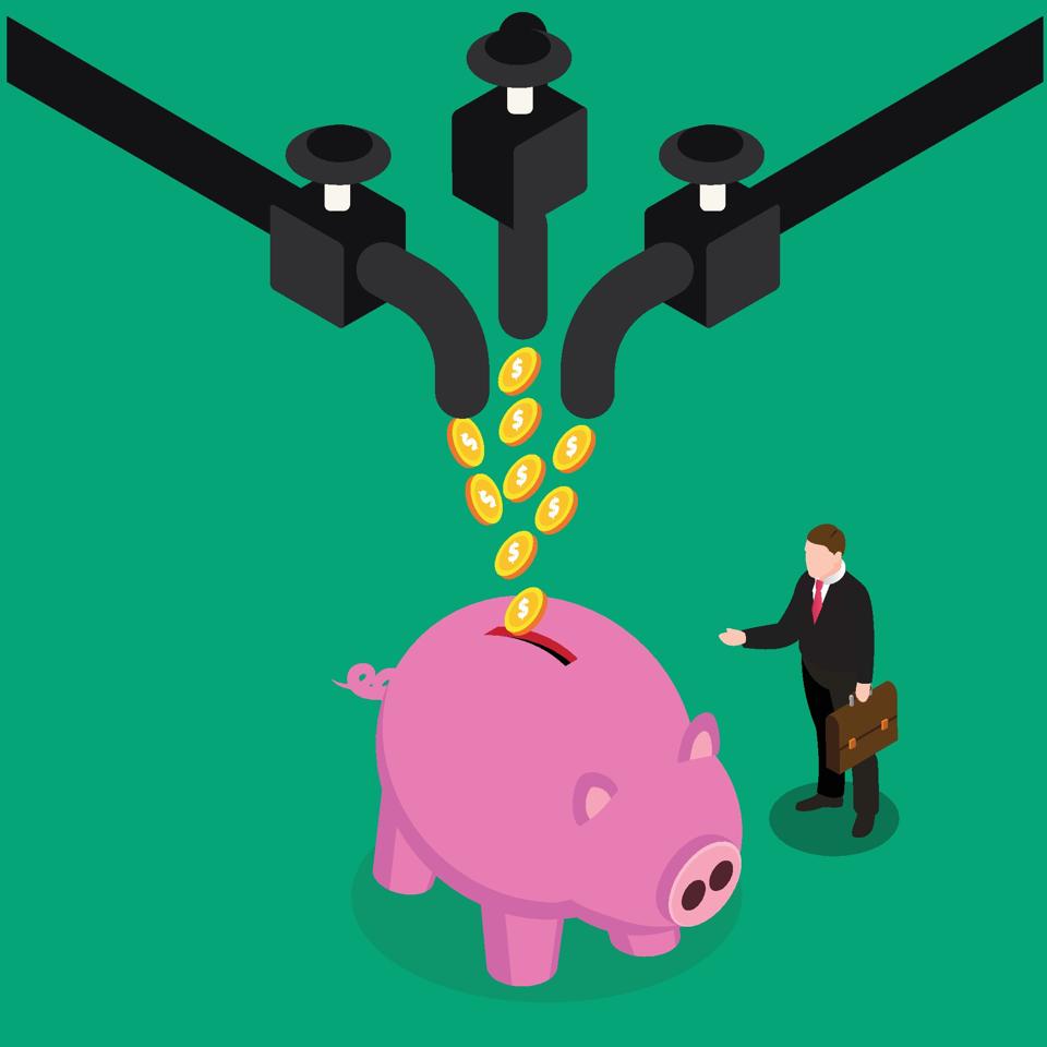 Busy professional managing passive income streams with laptop and financial charts