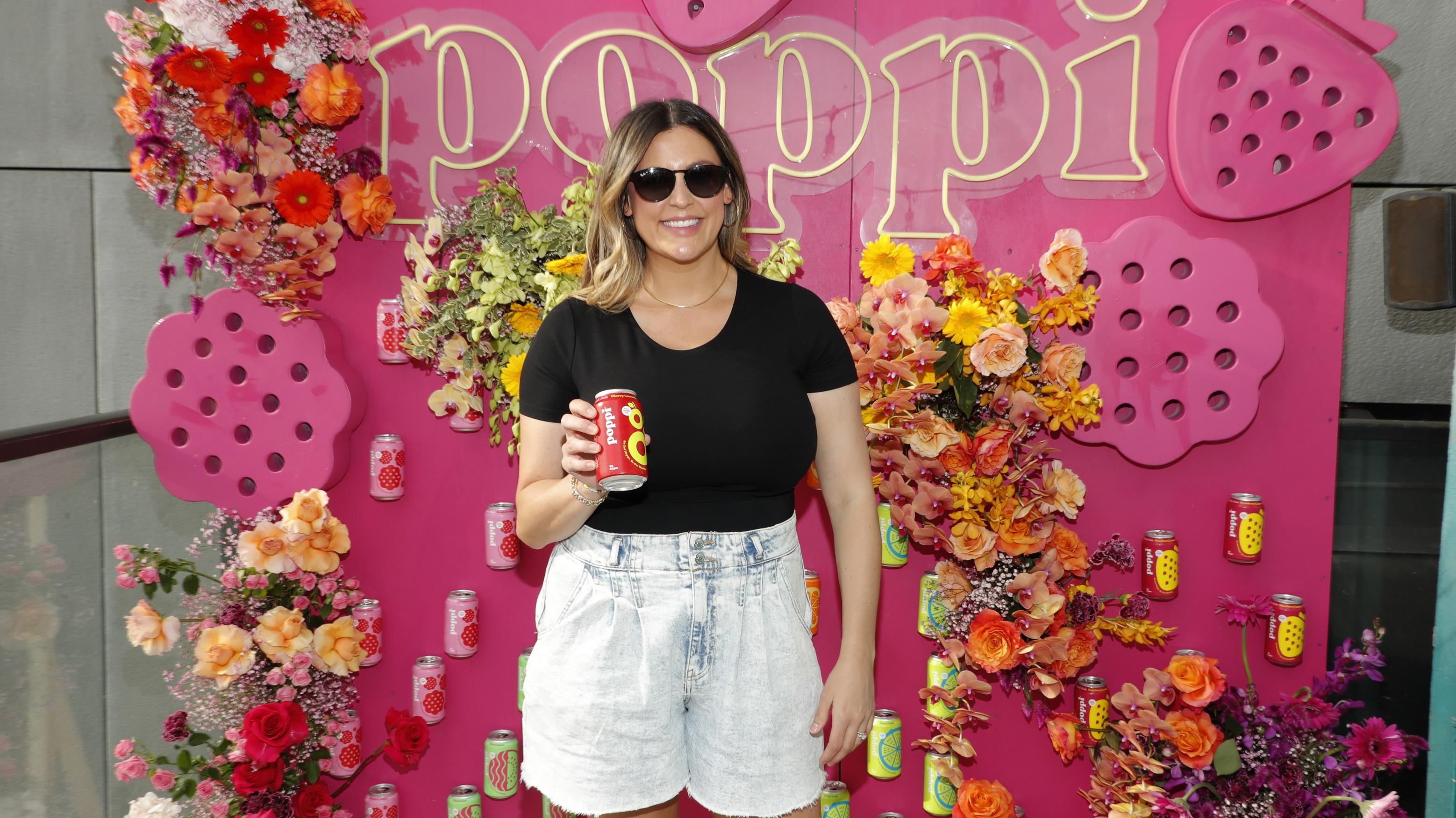 Allison Ellsworth, Poppi co-founder, holds a can of her beverage brand.