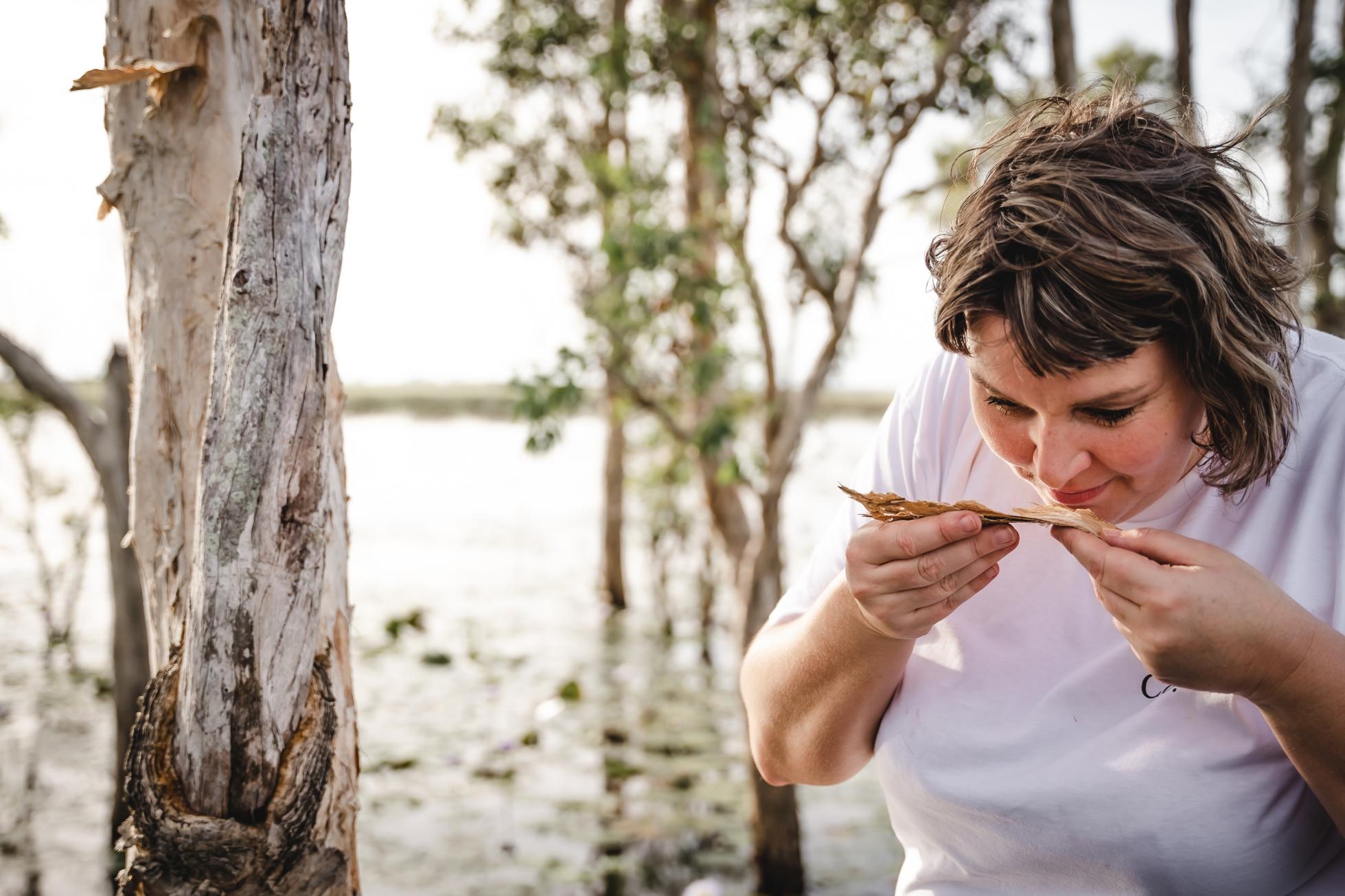 A guest on the Heli-Foraging Experience with Darwin Distilling Co. in Australia.
