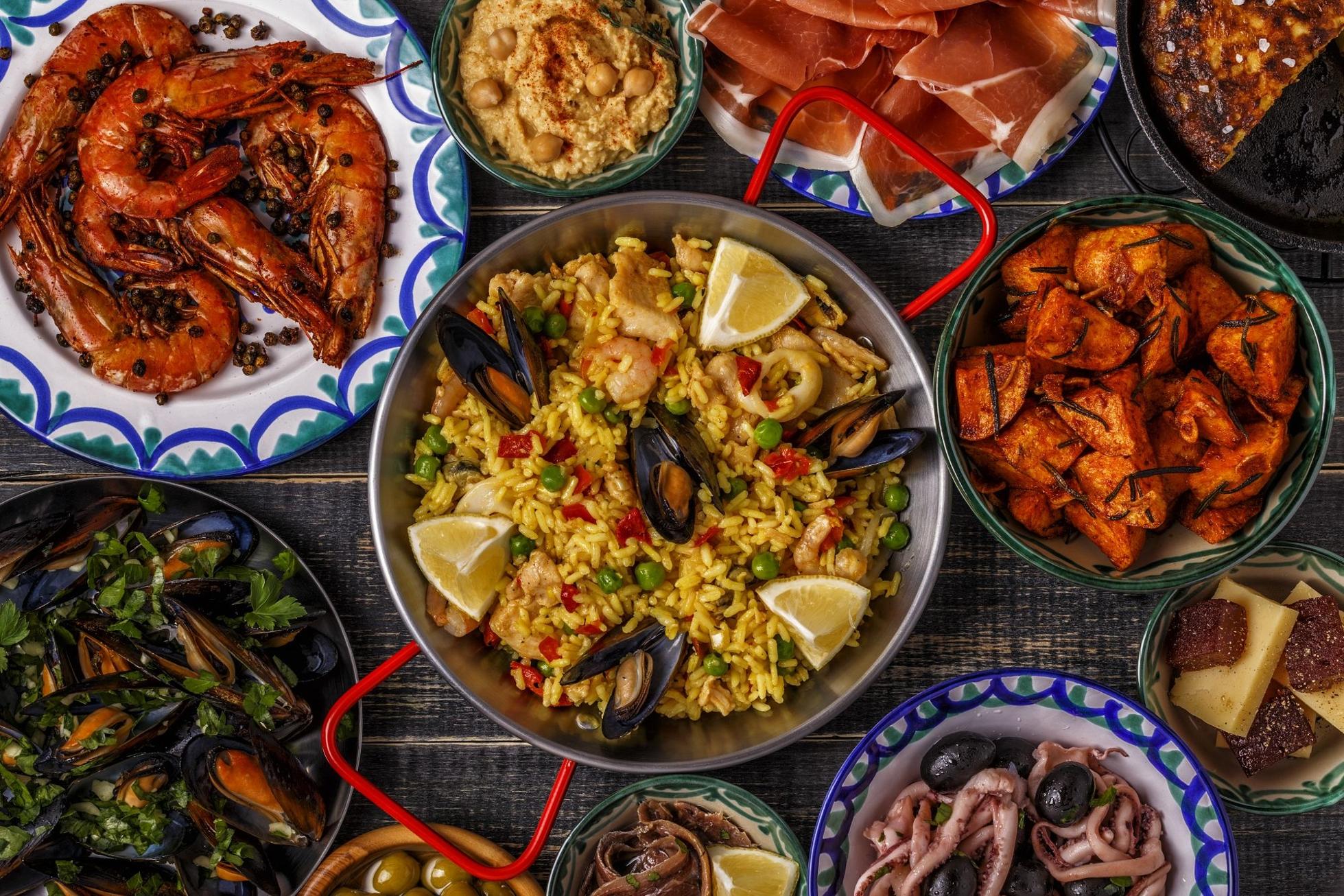 Typical Spanish tapas colorfully displayed on a table