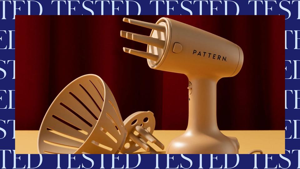 Pattern Hair Steamer and two attachments on light brown surface