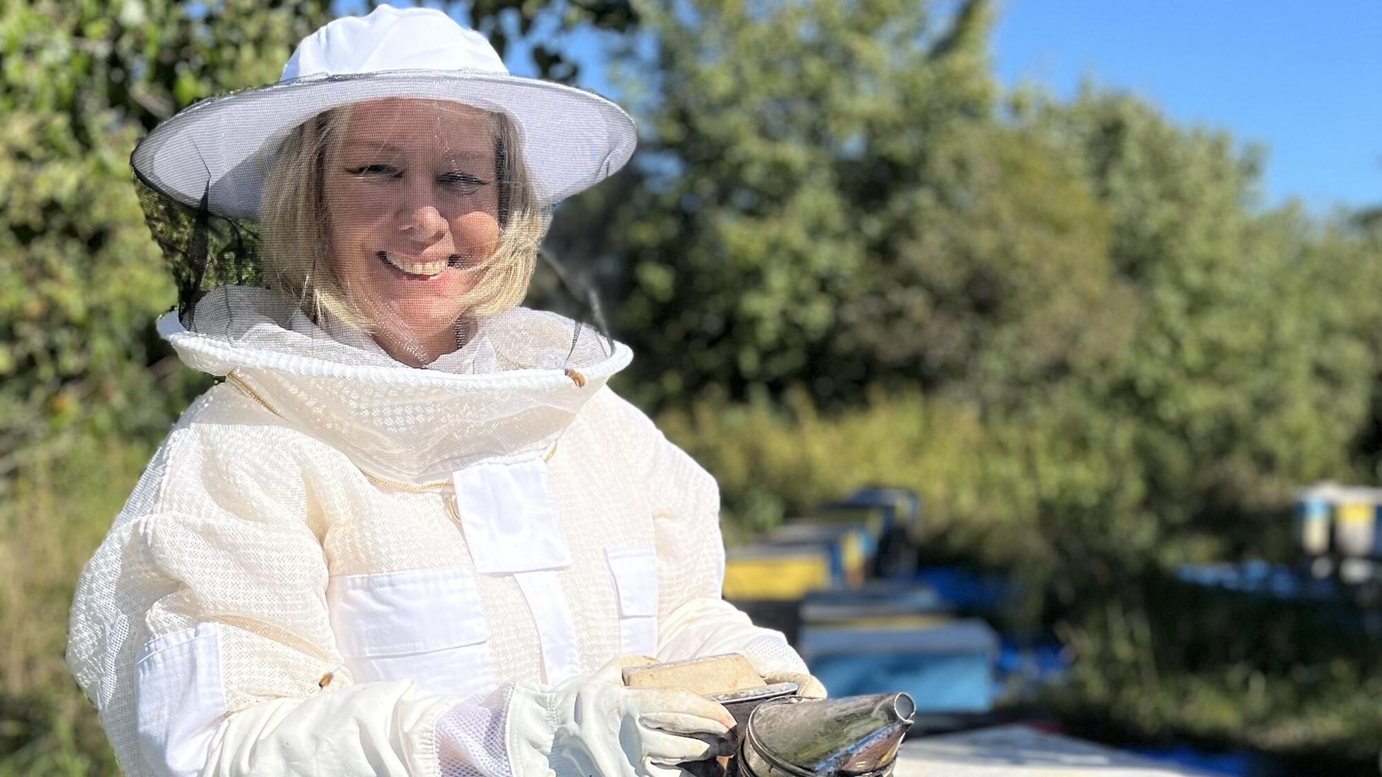 Dalan Animal Health cofounder and CEO Annette Kleiser in a beekeeping uniform.