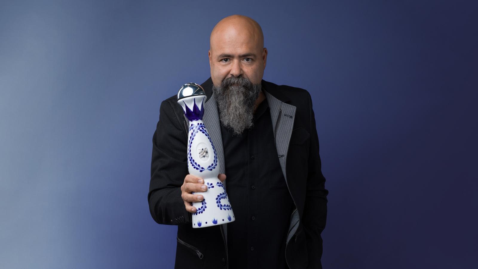 Clase Azul founder and CEO Arturo Lomeli holds a bottle of his company's tequila.
