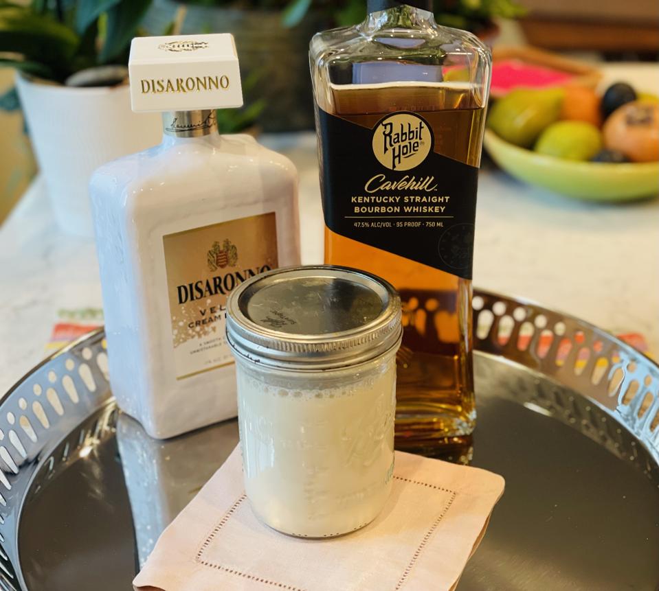 Add a liqueur instead of sugar or simple syrup for extra flavor and dimension. In this photo by Elizabeth Karmel is a bottle of Rabbit Hole bourbon and Disaronno Velvet Cream Liqueur and a mason jar of milk punch.