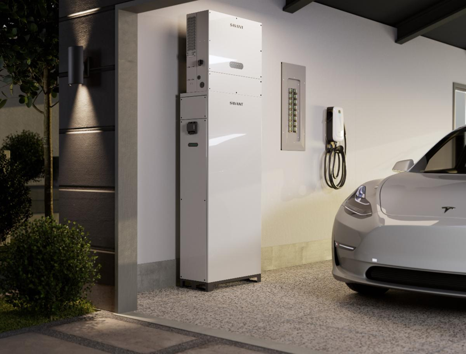 Smart home storage battery next to EV and charging station in a home garage.