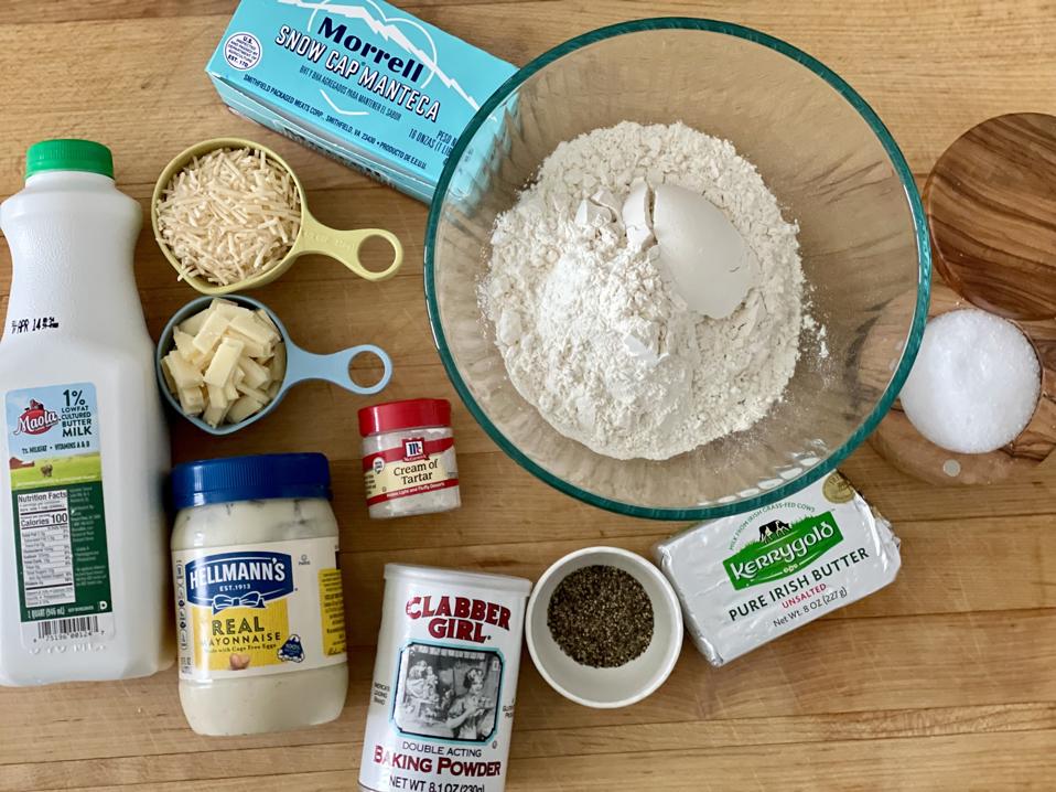 The recipe includes classic southern biscuit ingredients including lard, buttermilk, butter and flour and unexpected ingredients like coarse black pepper and two kinds of cheese. In this photo by Elizabeth Karmel are all the ingredients needed to make the Cacio et Pepe biscuits including the ones listed above as well as Cream of Tartar, baking powder, mayonnaise and salt. 