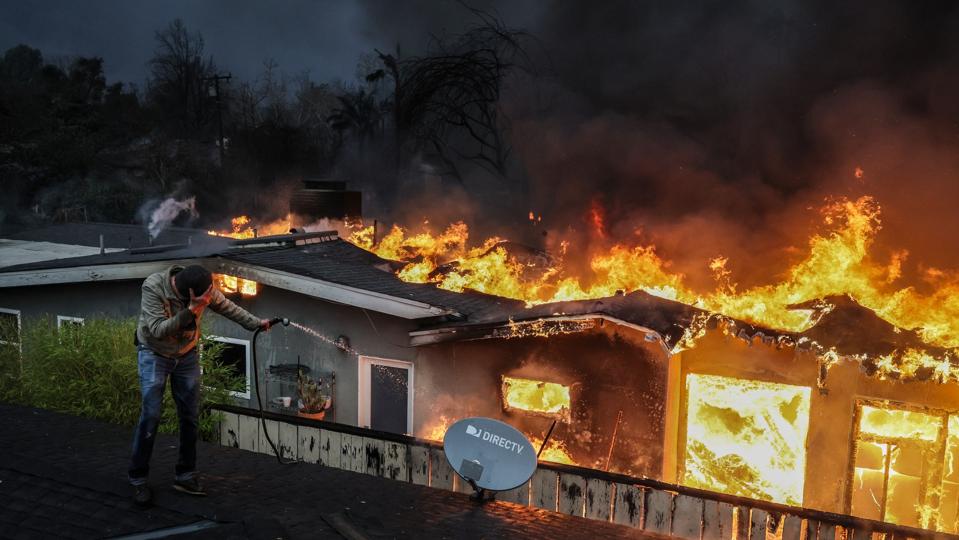 Eaton fire burns homes in Altadena.