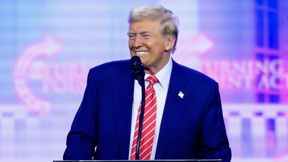 Donald Trump smiling at podium