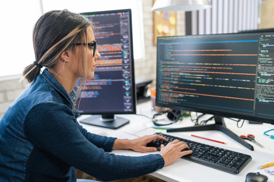 Female freelance developer coding and programming