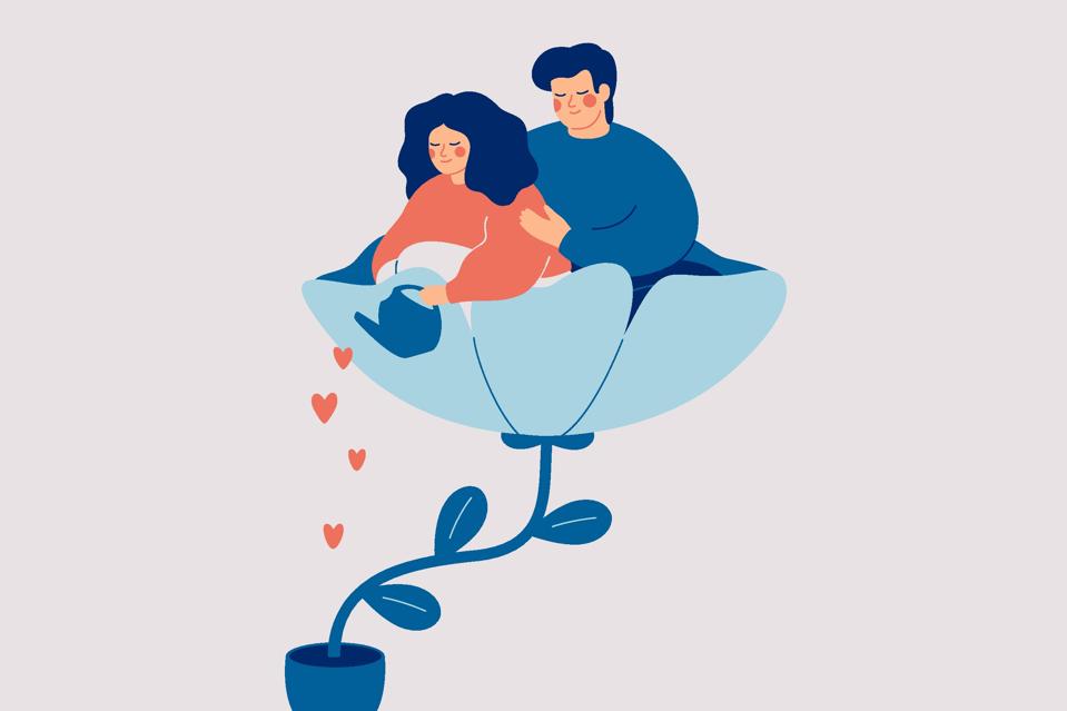 Happy couple hugging in the flower and watering it. Female caring for her husband with love. Wellbeing Relationships and mental health in the family.