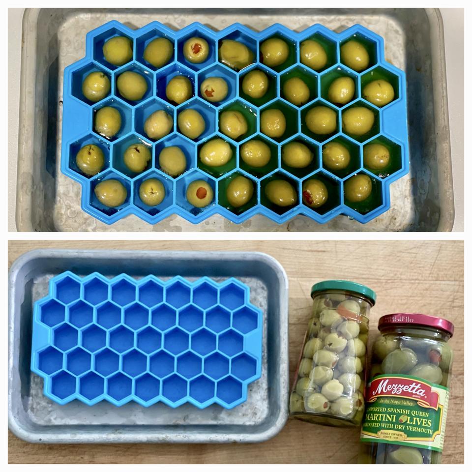Making the mini olive ice cubes is easy with a small silicone ice cube tray and small pimento-stuffed olives. In this photo by Elizabeth Karmel is a small hexagonal ice cube tray, a jar of small olives and a jar of martini olives with a Vermouth brine. 