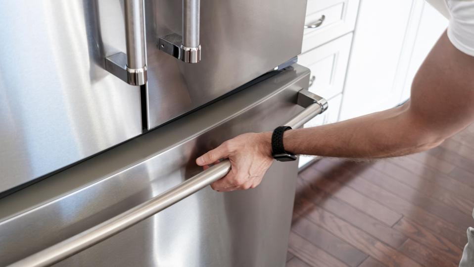 Man Opens Freezer Door