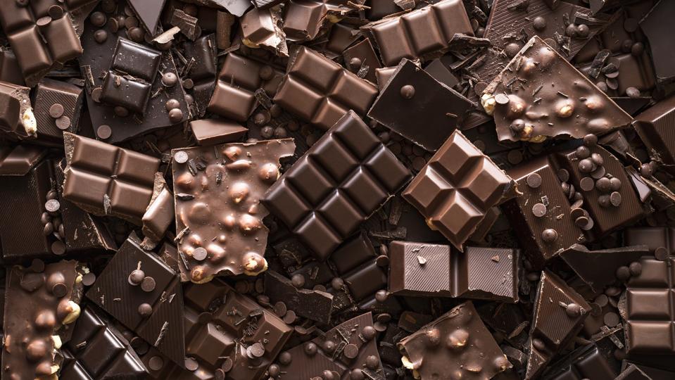 Chocolate assortment background. Top view of different kinds of chocolate