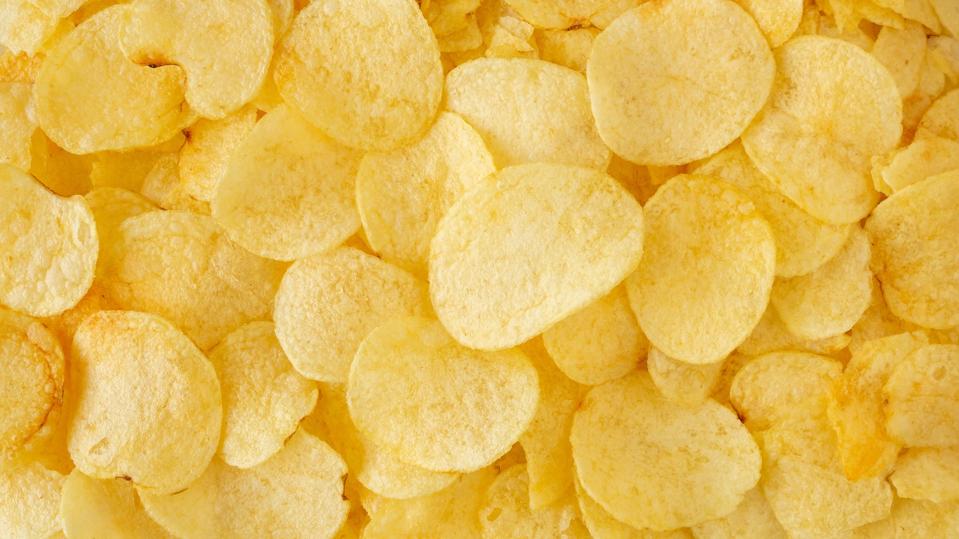 crispy potato chips snack texture background top view