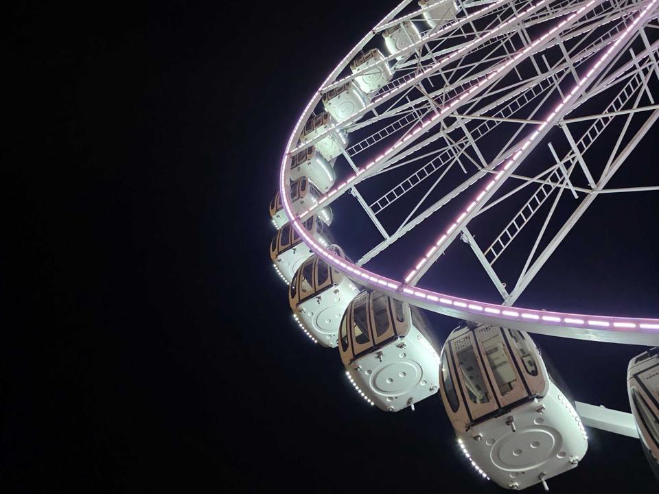 A Ferris Wheel at night.