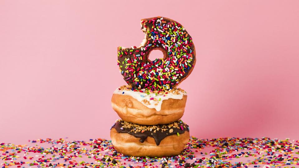 Three donuts, one with bite