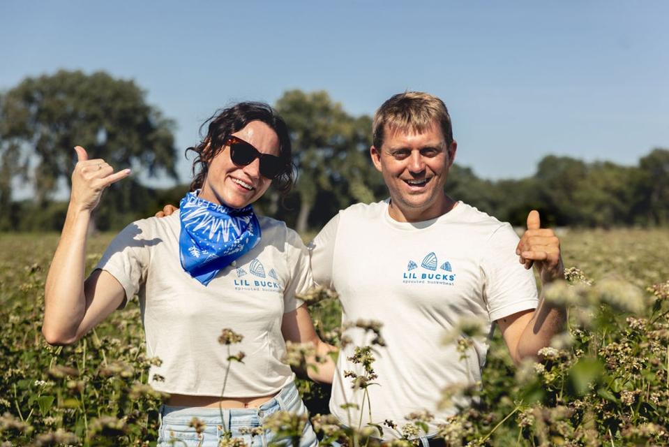 Griffith and Peterson in a buckwheat field at A-Frame Farm