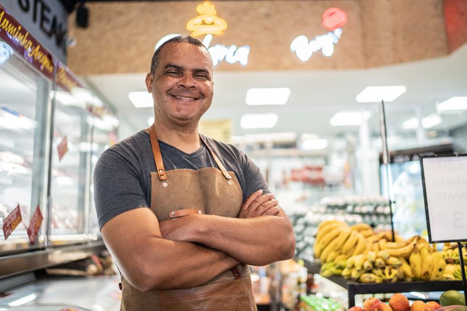 Portrait of a market owner.