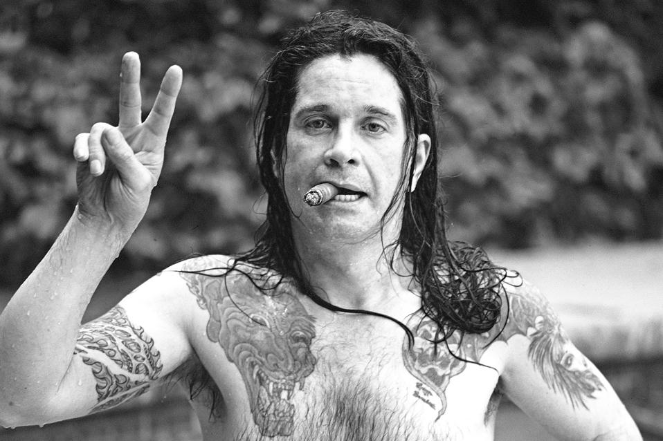 Singer Ozzy Osborne In His Pool With Cigar At His Beverly Hills, California Home In June 1987.