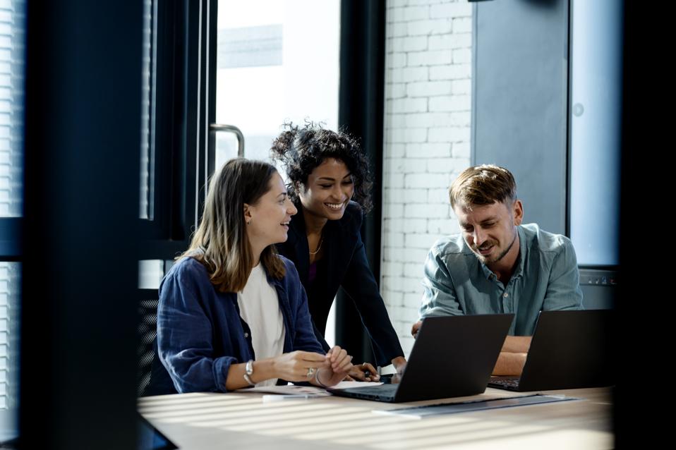 Use Performance Insights To Drive Business Growth. Team of business development is on a data discussion to improve solutions, products, or services during a meeting in a business office.