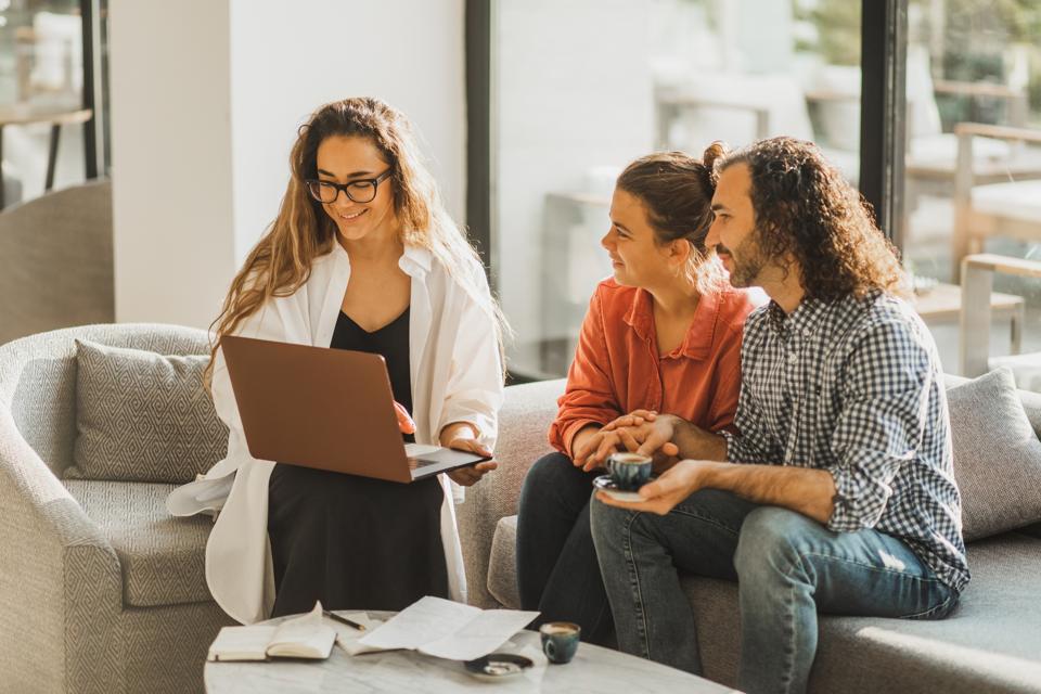 Insurer financial advisor make business offer to interested clients look at computer