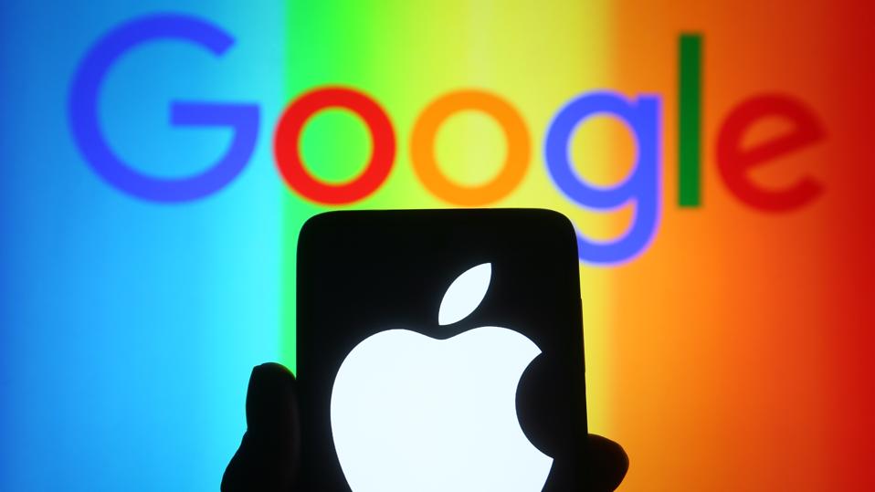 In this photo illustration, an Apple logo is seen on a...