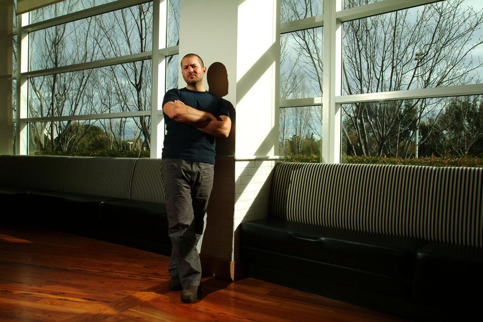 Jonathan (Jony) Ive leans against a wall.