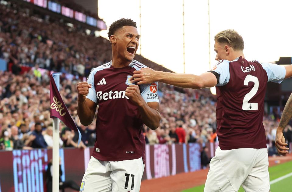 Aston Villa forward Ollie Watkins celebrating with Matty Cash.