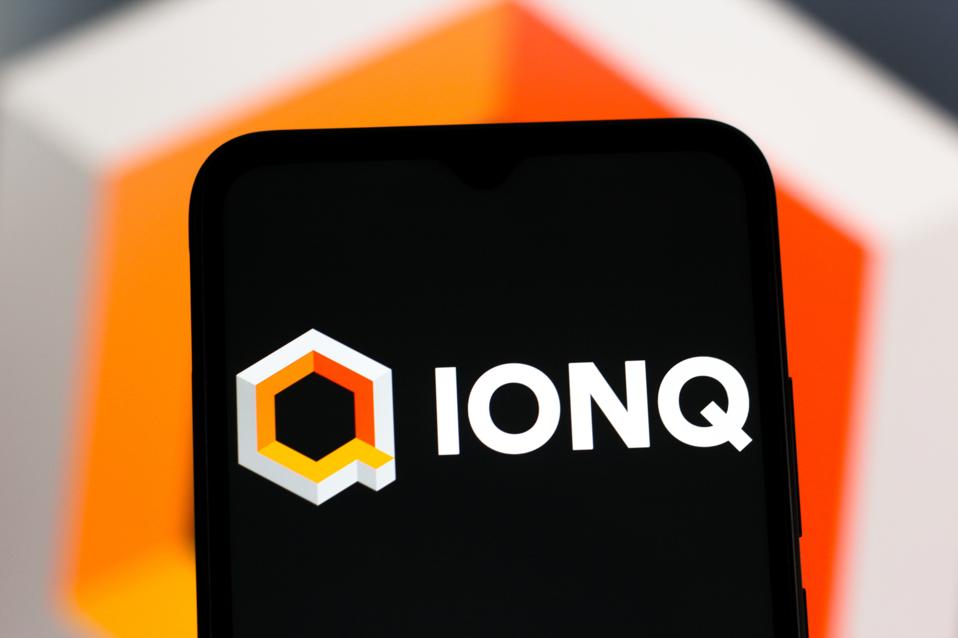 In this photo illustration, the IonQ logo is seen displayed...