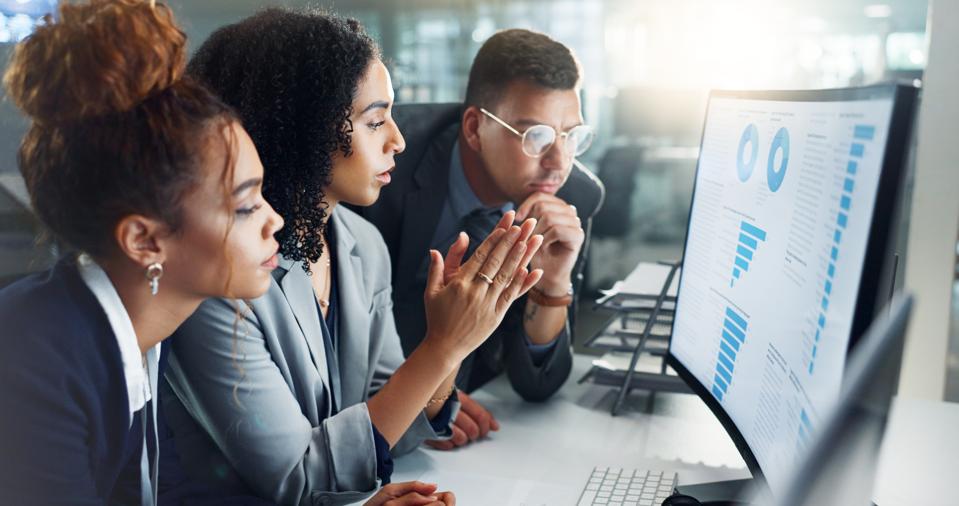 Employees, computer and night for finance, chart and planning on screen for data analytics. Business people, brainstorming and teamwork or graphs, sale profit and statistics on investment revenue